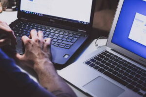 Men working in a laptop